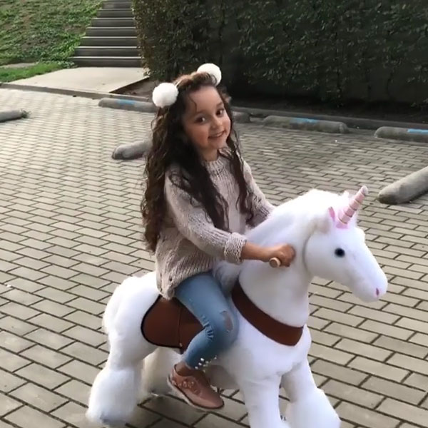 Happy with my unicorn ride on toy